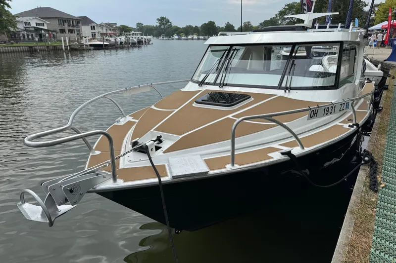  Yacht Photos Pics 2025 Extreme Boats 986 Game King docked by waterfront homes.