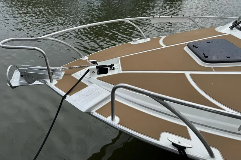  Yacht Photos Pics 2025 Extreme Boats 986 Game King bow with anchor, on calm water.