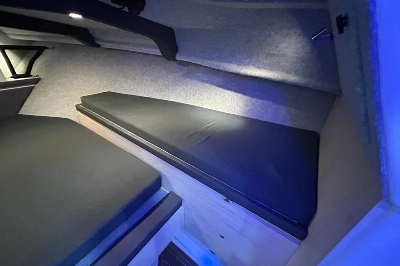  Yacht Photos Pics 2025 Extreme Boats 986 Game King interior cabin with cushioned seating and ambient lighting.