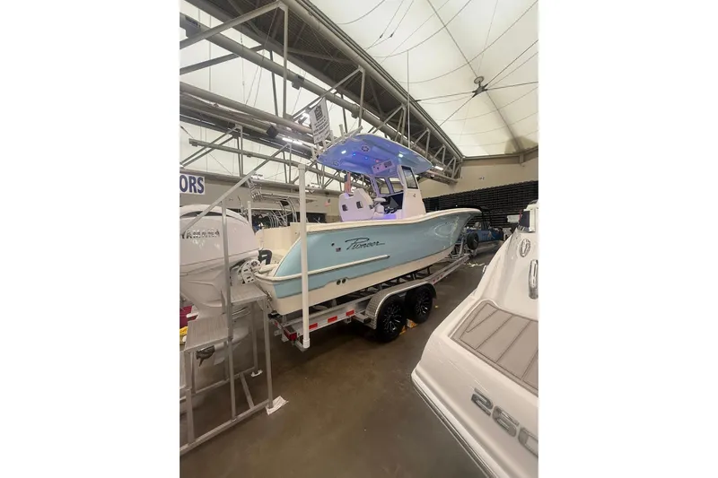 Yacht Photos Pics 2026 Pioneer 250 Pelagic boat displayed indoors on a trailer.