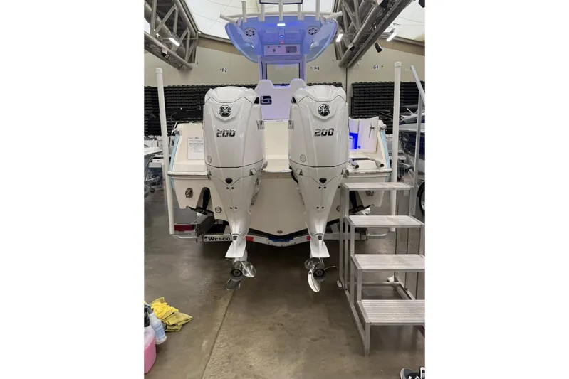  Yacht Photos Pics 2026 Pioneer 250 Pelagic boat with dual Yamaha 200 engines in showroom.