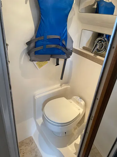  Yacht Photos Pics 2003 Regal 3860 Commodore bathroom with toilet and life jacket.