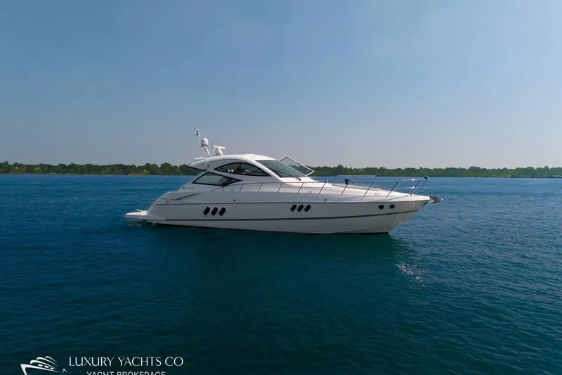  Yacht Photos Pics 2015 Cruisers Yachts 540 on calm blue water, showcasing sleek design and luxury.
