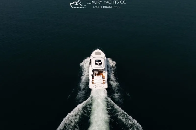  Yacht Photos Pics Aerial view of 2015 Cruisers Yachts 540 sailing on open water.