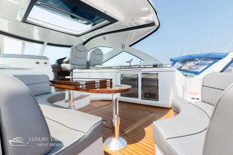 Yacht Photos Pics Luxurious 2015 Cruisers Yachts 540 interior with elegant seating and modern amenities.