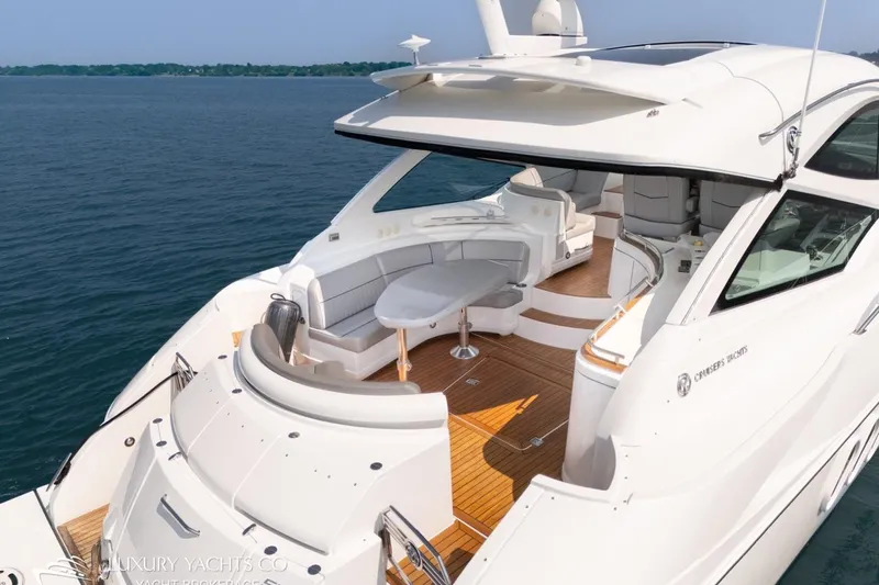  Yacht Photos Pics Luxurious 2015 Cruisers Yachts 540 with spacious deck and elegant seating on open water.