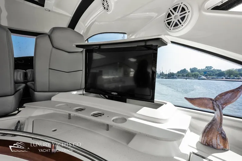  Yacht Photos Pics Luxurious interior of 2015 Cruisers Yachts 540 with TV and scenic water view.