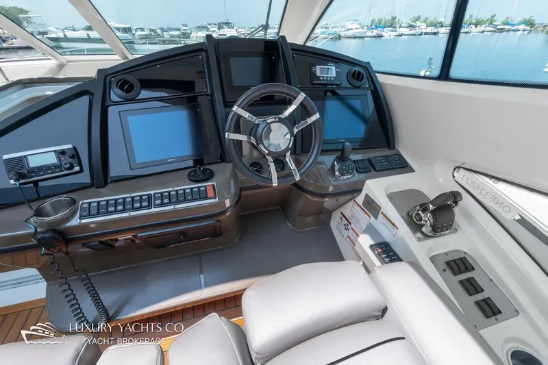  Yacht Photos Pics Helm of 2015 Cruisers Yachts 540, featuring advanced navigation and control systems.