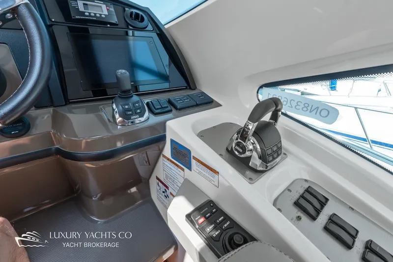  Yacht Photos Pics 2015 Cruisers Yachts 540 helm with advanced controls and navigation systems.