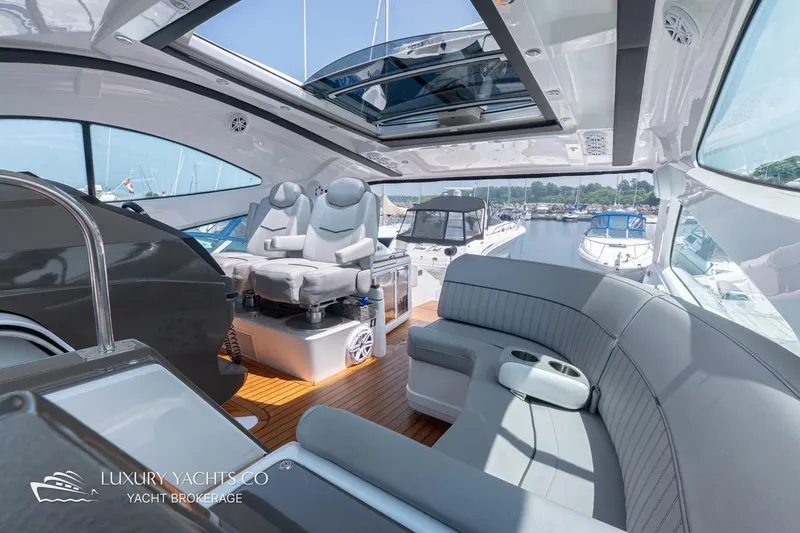  Yacht Photos Pics Luxurious 2015 Cruisers Yachts 540 interior with plush seating and modern design.