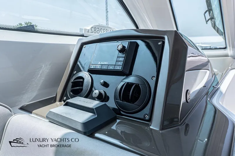  Yacht Photos Pics Dashboard of 2015 Cruisers Yachts 540 featuring JL Audio system and air vents.