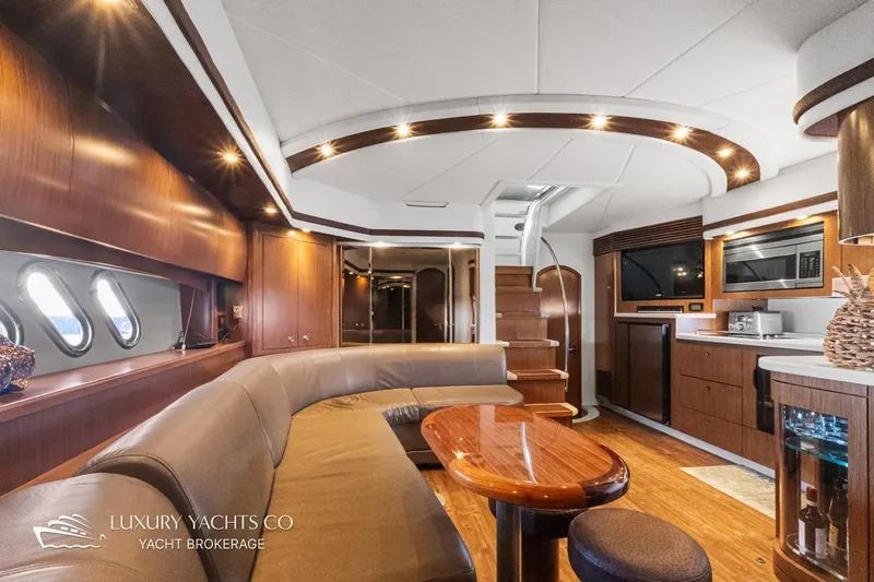  Yacht Photos Pics Luxurious interior of 2015 Cruisers Yachts 540 with elegant wood finishes and modern amenities.