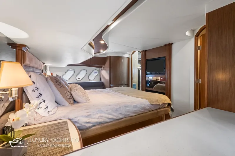 Yacht Photos Pics Luxurious 2015 Cruisers Yachts 540 interior with elegant bedroom and modern amenities.