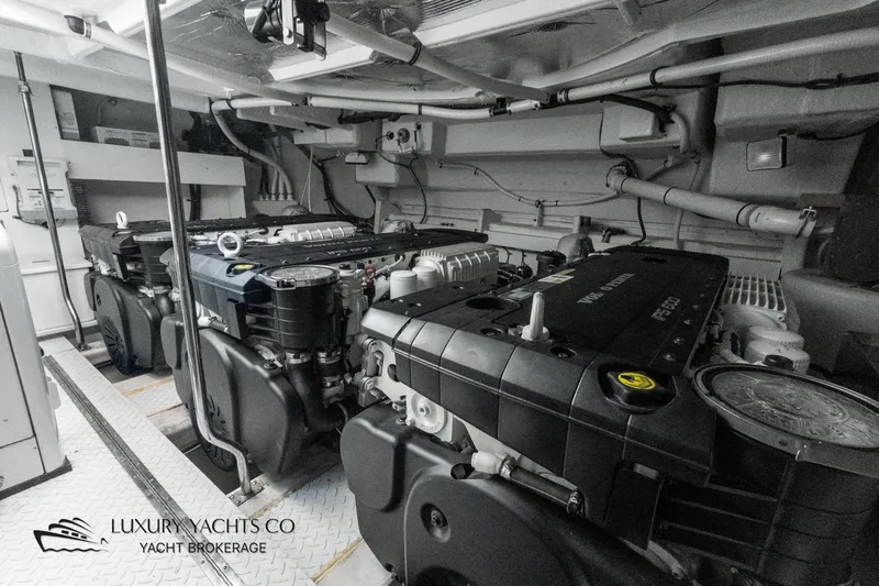  Yacht Photos Pics Engine room of 2015 Cruisers Yachts 540, showcasing powerful machinery and clean design.