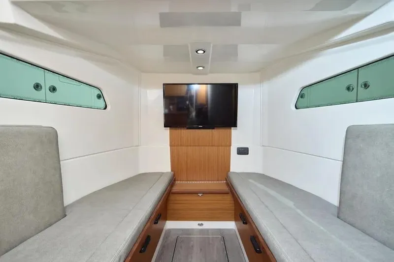  Yacht Photos Pics Interior of 2022 Solace 41 CS boat with modern seating and wall-mounted TV.