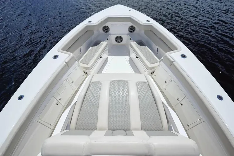  Yacht Photos Pics 2022 Solace 41 CS boat interior with luxurious seating and speakers on calm water.