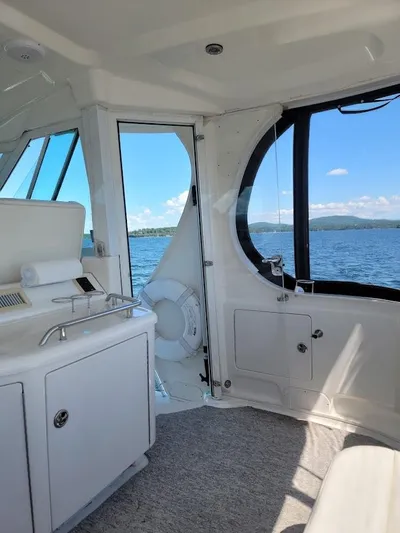  Yacht Photos Pics Interior view of 2003 Sea Ray 390 Motor Yacht with lake scenery.