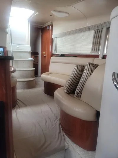  Yacht Photos Pics Interior of 2003 Sea Ray 390 Motor Yacht with beige seating and striped pillows.