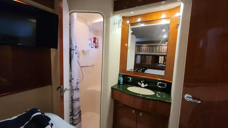  Yacht Photos Pics 2003 Sea Ray 390 Motor Yacht bathroom with vanity, mirror, and shower.