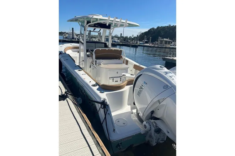 Wrecking Ball Yacht Photos Pics 2023 Sea Hunt Ultra 305 SE boat docked at marina, featuring dual engines.