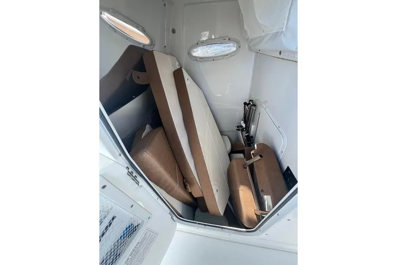 Wrecking Ball Yacht Photos Pics 2023 Sea Hunt Ultra 305 SE interior cabin with folded seating.