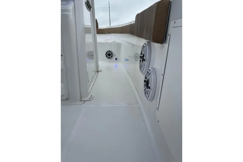 Wrecking Ball Yacht Photos Pics 2023 Sea Hunt Ultra 305 SE boat interior with speakers and cushioned seating.