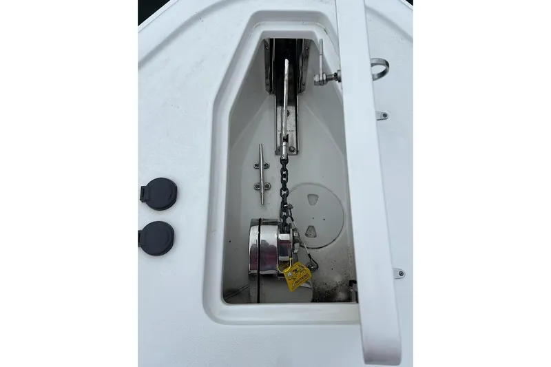 Wrecking Ball Yacht Photos Pics Anchor compartment of 2023 Sea Hunt Ultra 305 SE boat, featuring chain and hardware.