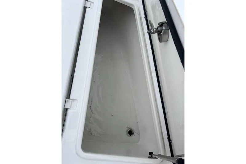 Wrecking Ball Yacht Photos Pics 2023 Sea Hunt Ultra 305 SE storage compartment, open and empty.