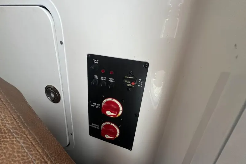 Wrecking Ball Yacht Photos Pics Control panel on 2023 Sea Hunt Ultra 305 SE boat, featuring battery switches and indicators.