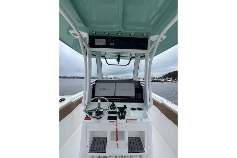 Wrecking Ball Yacht Photos Pics 2023 Sea Hunt Ultra 305 SE boat console with Garmin navigation system on open water.