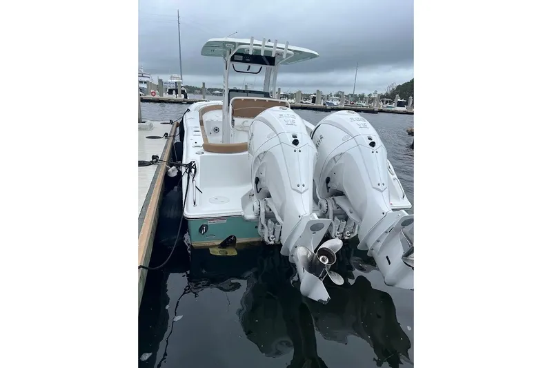 Wrecking Ball Yacht Photos Pics 2023 Sea Hunt Ultra 305 SE boat docked with dual outboard engines.