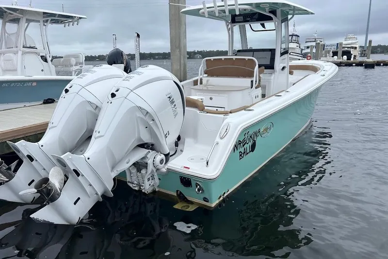 Wrecking Ball Yacht Photos Pics 2023 Sea Hunt Ultra 305 SE boat docked with twin Yamaha engines.