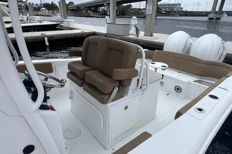 Wrecking Ball Yacht Photos Pics 2023 Sea Hunt Ultra 305 SE boat interior with dual seats and steering console.