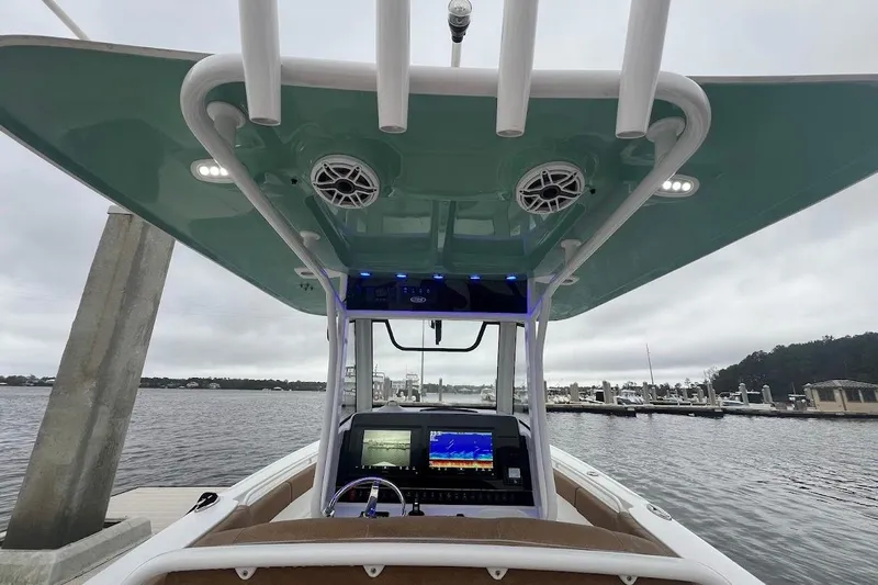 Wrecking Ball Yacht Photos Pics 2023 Sea Hunt Ultra 305 SE boat interior with advanced navigation system and speakers.