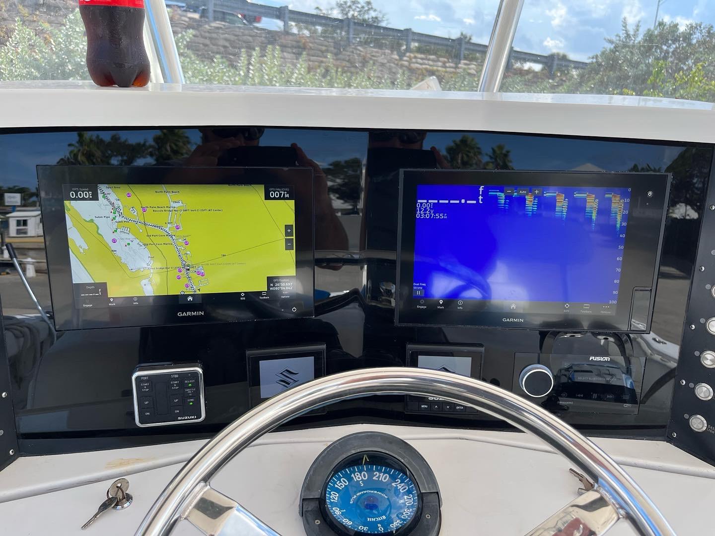 2004 Venture 34 Center Console dashboard with navigation and sonar displays.