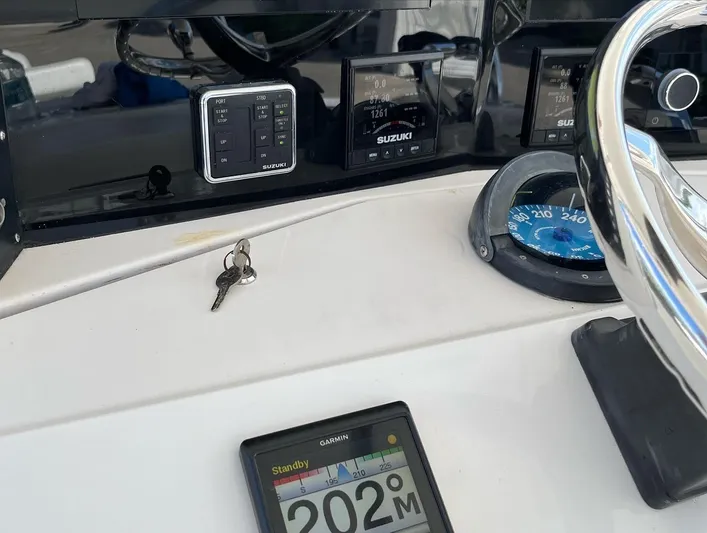 Growing Grass Yacht Photos Pics Close-up of the dashboard of a 2004 Venture 34 Center Console boat.