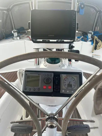 Top Dog Yacht Photos Pics Cockpit of a 2006 Hunter 38 Ft Sloop with navigation instruments.
