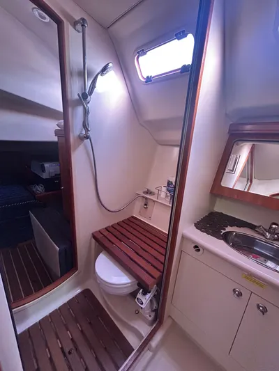 Top Dog Yacht Photos Pics Interior of a 2006 Hunter 38 Ft Sloop with bathroom and shower.