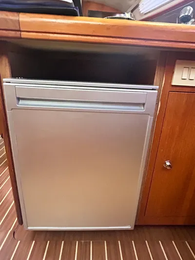 Top Dog Yacht Photos Pics Galley area of a 2006 Hunter 38 Ft Sloop with refrigerator.