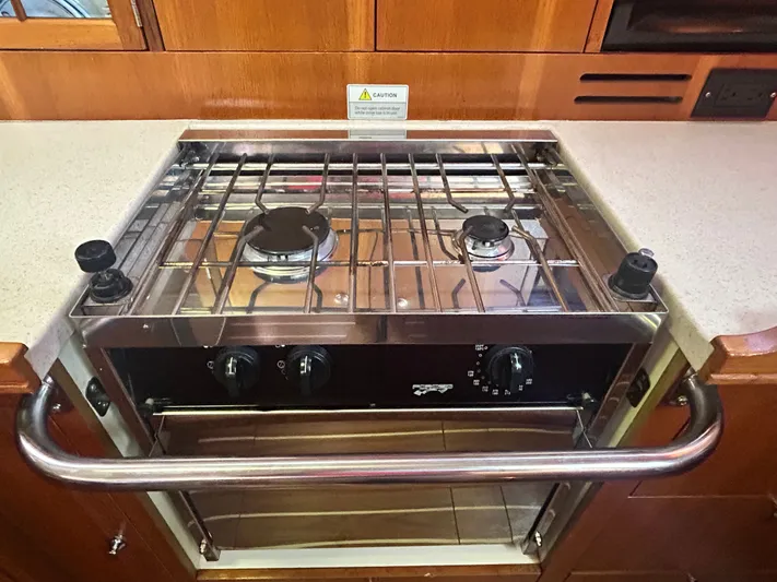 Top Dog Yacht Photos Pics Stove inside a 2006 Hunter 38 Ft Sloop yacht.