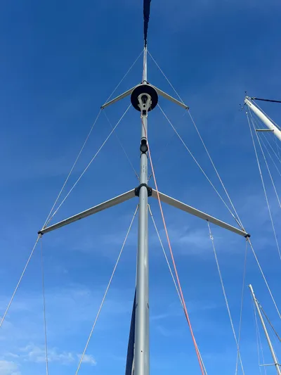 Top Dog Yacht Photos Pics Mast of a 2006 Hunter 38 Ft Sloop against blue sky.