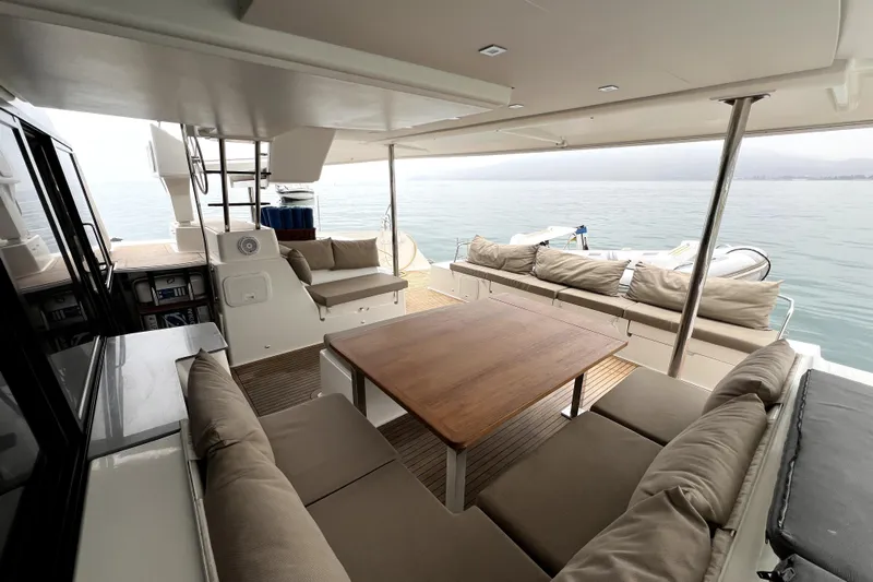 4life Yacht Photos Pics Spacious deck of 2016 Fountaine Pajot SABA 50 catamaran with comfortable seating and ocean view.