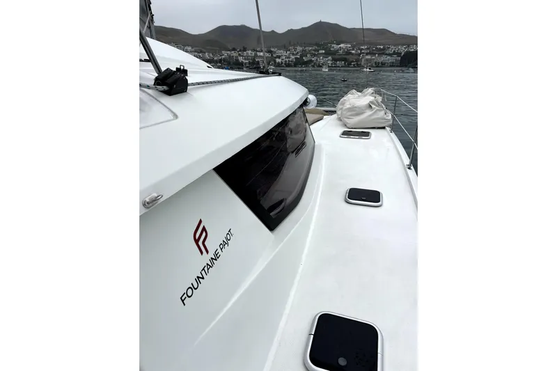 4life Yacht Photos Pics 2016 Fountaine Pajot SABA 50 catamaran on water, showcasing sleek design and branding.