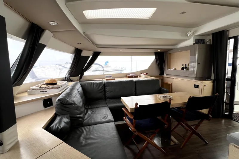 4life Yacht Photos Pics Luxurious interior of 2016 Fountaine Pajot SABA 50 yacht with modern seating and dining area.