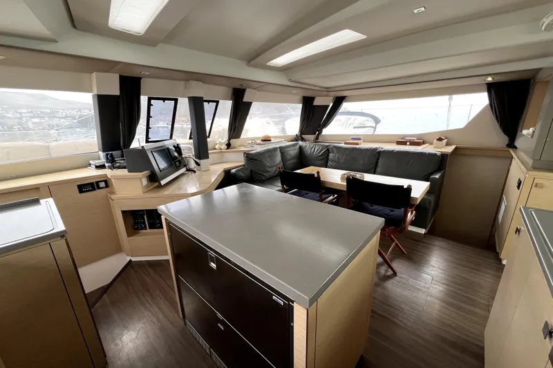 4life Yacht Photos Pics Luxurious interior of 2016 Fountaine Pajot SABA 50 catamaran with modern seating and navigation area.