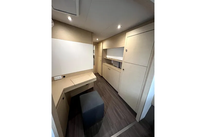 4life Yacht Photos Pics Interior of 2016 Fountaine Pajot SABA 50 yacht with modern wood cabinetry and seating.