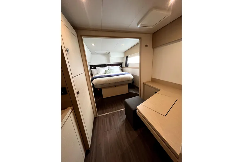 4life Yacht Photos Pics Luxurious cabin interior of 2016 Fountaine Pajot SABA 50 yacht, featuring modern design and cozy bed.