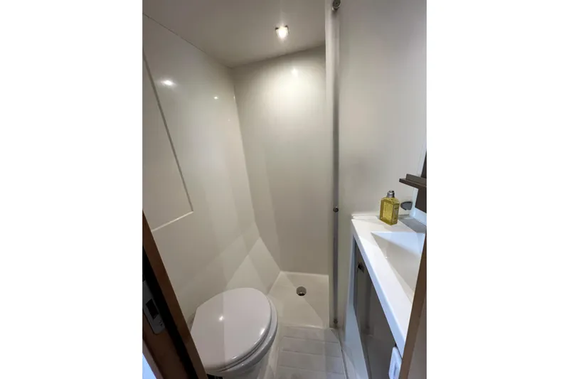 4life Yacht Photos Pics Bathroom interior of 2016 Fountaine Pajot SABA 50 yacht, featuring modern fixtures.