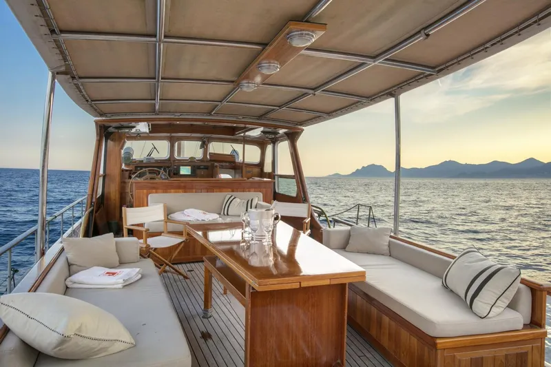 Atalanta J Yacht Photos Pics Luxurious 1958 Feadship ATALANTA J yacht deck with elegant seating and ocean view.