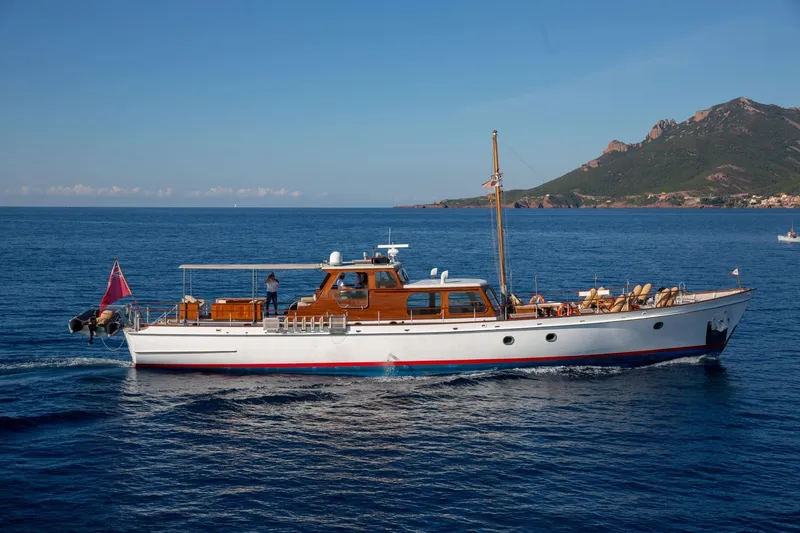 Atalanta J Yacht Photos Pics Classic 1958 Feadship ATALANTA J yacht cruising near scenic coastline.